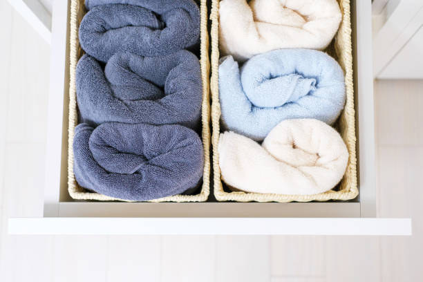 istock Rolled towels in boxes in dresser top view, space organization concept. 1399385551