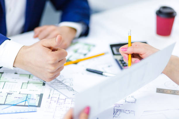 istock Close up photo of hands working with papers at office. 1399385759