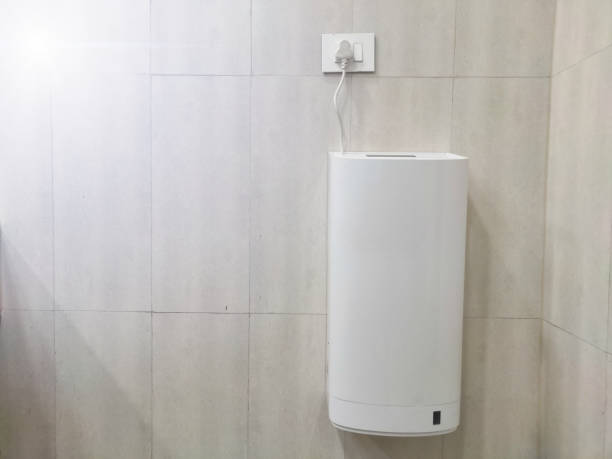 istock Hand dryer  used in washroom for blow dry wet hands , machine is automatic and  sensor operated blow hot air , it's modern restroom design interior object mounted on wall from view with copy space for text. 1399387316