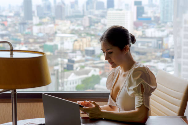 istock Business woman is working at hotel room. 1399388433