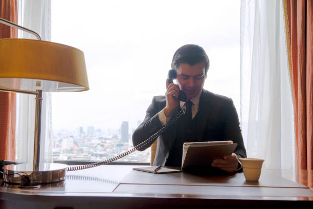 istock Business man is working at hotel room. 1399388688