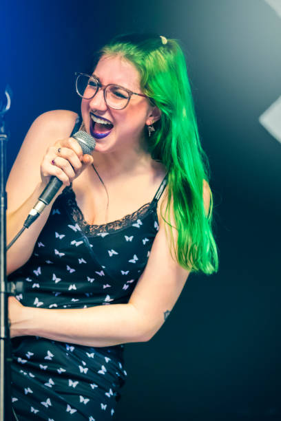 istock Female Metal Singer Performing Live 1399392524