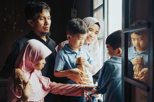 Portrait of muslim family at wooden house