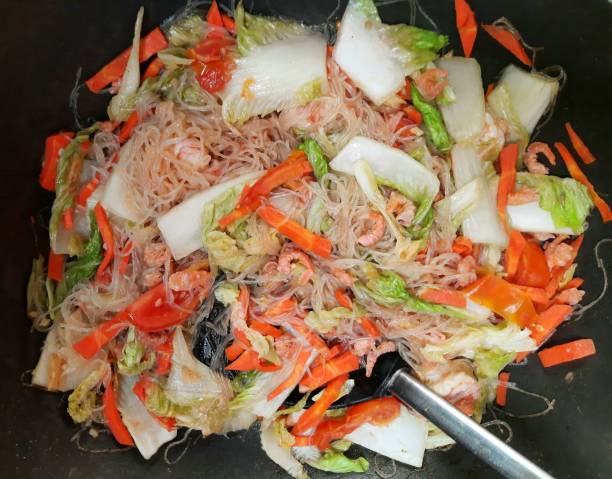 Cooking Stir fried Rice noodle with Cabbage and Carrot. stock photo