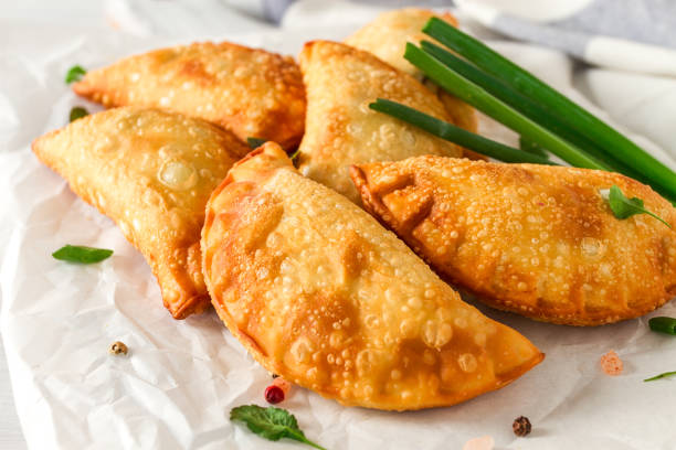 istock Fried chebureks, close-up, on a light background, no people, 1399395870