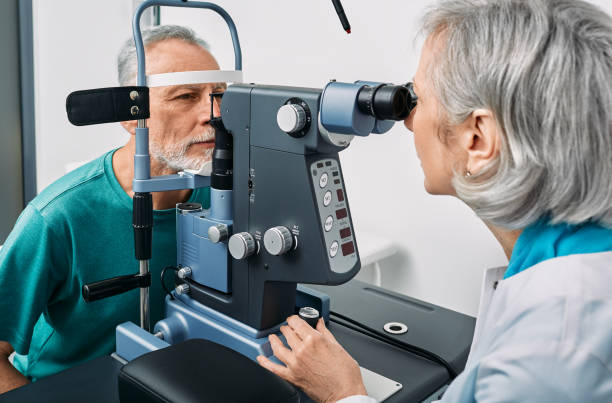 istock Experienced optometrist doing sight test for senior man at modern ophthalmology clinic. Eye exam and vision diagnostic 1399397922