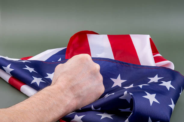 istock Fist holding United States flag. 1399399417