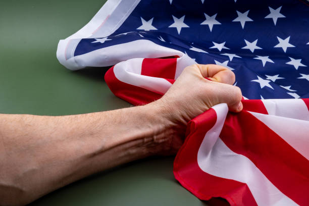 istock Fist holding United States flag. 1399399442