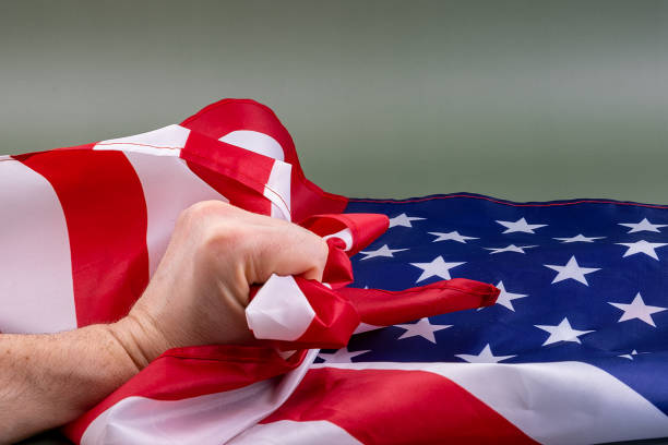 istock Fist holding United States flag. 1399399457