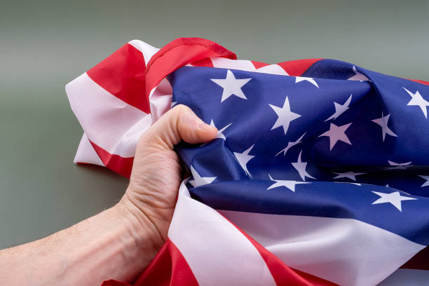 istock Fist holding United States flag. 1399399460