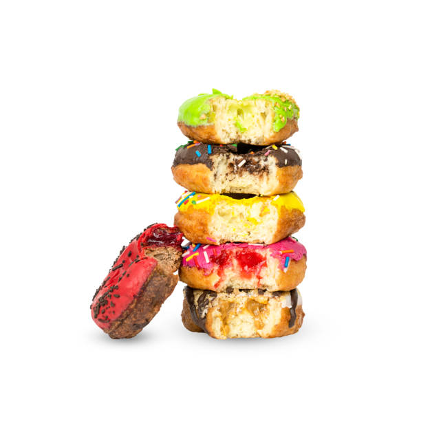 istock Stack of donuts with different fillings isolated on white background 1399399881