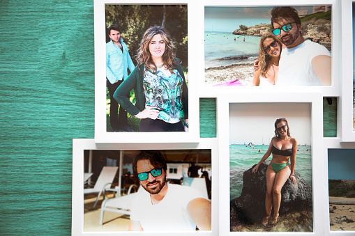 A frame of several photos of a couple in love on their summer vacations, by the beaches of Mallorca. with a turquoise blue wooden background.