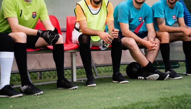 istock Soccer team players are resting on the bench 1399402224