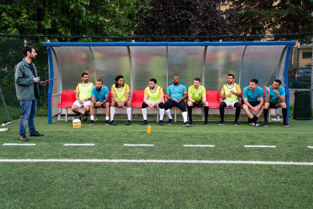 istock The coach is directing the team on the bench 1399402235