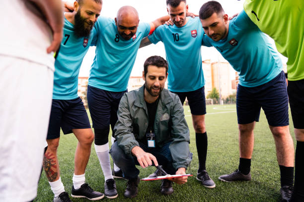 istock The coach is explaining his tactics to the soccer team 1399402236