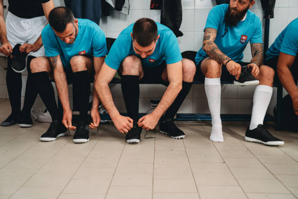 istock Soccer team players are getting ready in the changing room before the match 1399402301