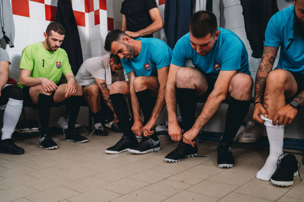 istock Soccer team players are getting ready in the changing room before the match 1399402307