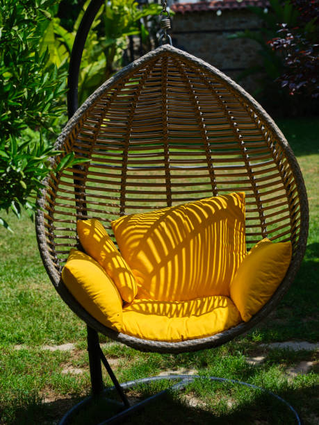 istock yellow padded swing seat in the garden 1399402462