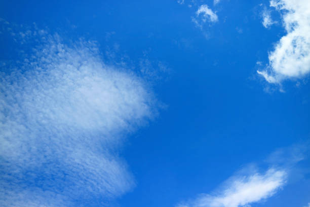 istock Vibrant Blue Sky with Spreading Pure White Clouds 1399402877
