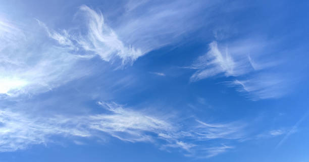 istock blue sky with white clouds and sun light. Nature background of sky 1399403790