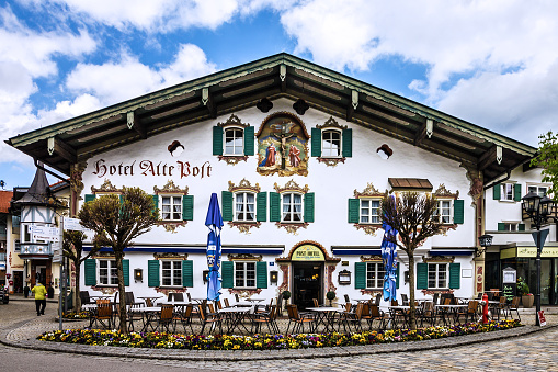 Bavaria, Germany - May 26, 2022: Painting house in village Oberammergau, Hotel and cafeteria