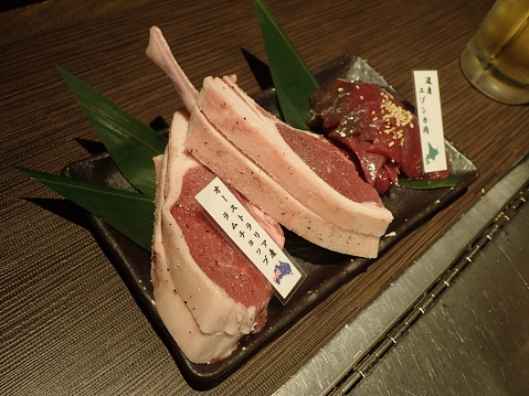 Hakodate, Japan - May 5, 2022: It is Australian lamb chops and Japanese Hokkaido Ezo venison. In Hokkaido, the Genghis Khan pot, which eats lamb meat on a special iron plate, is famous and very delicious.