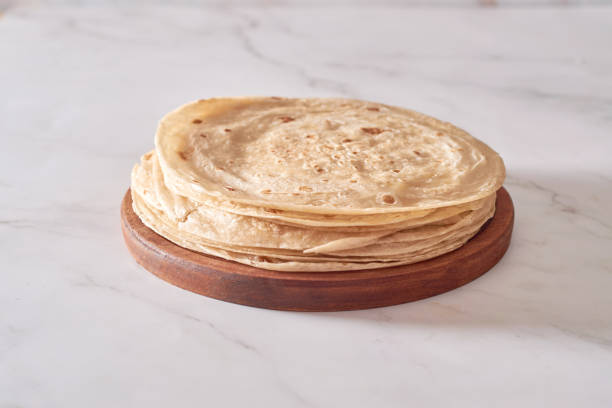 istock Stack of homemade whole wheat flour tortilla on plate 1399405637
