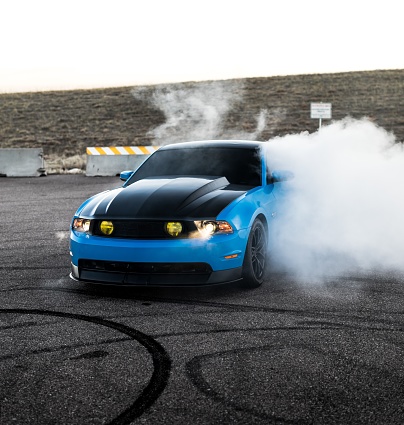 Seattle, WA, USA\n2/2/2020\nBlue Mustang with a black hood doing a burnout