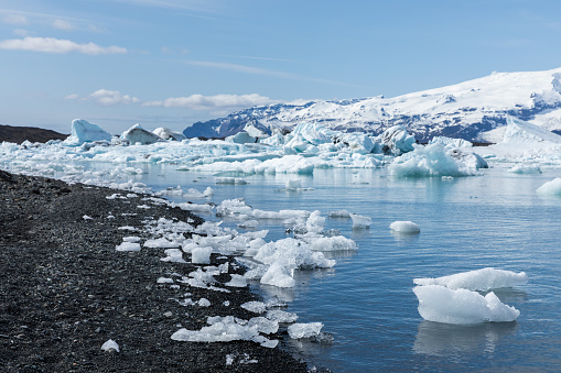 Jokulsarlon, a glacial lagoon with icebergs in southern Iceland. Jokulsarlon formed around 1935 and the size of the lake keeps increasing due to the melting glaciers.