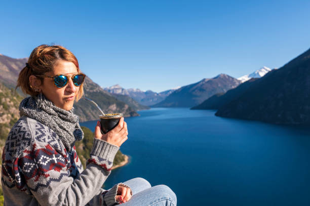 enjoying some delicious mates with a view of mountains and lakes. - bariloche imagens e fotografias de stock