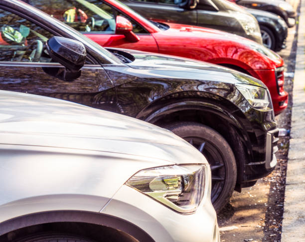 istock Cars parked in a row 1399411558