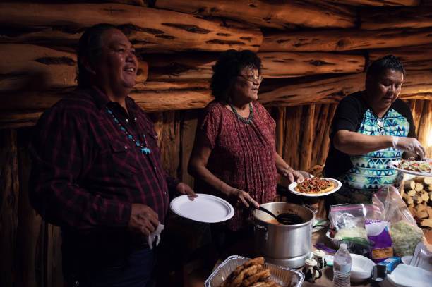 istock Family offering a traditional meal inside their hogan 1399413032