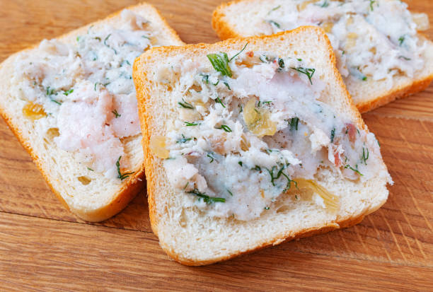 istock Bread spread with lard with spices, fresh dill and fried onions. 1399418066