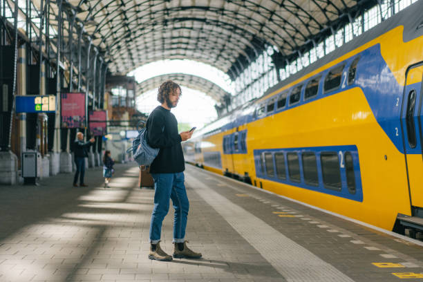 istock Man waiting for the train on railway station 1399418203