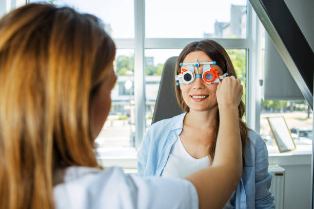 istock Ophthalmologist examining woman patient with optometrist trial frame 1399418272