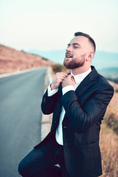 Smiling Male Getting Ready To Stop Car On Road