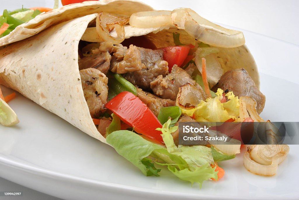 wrap with grilled pork and some vegetable Rolled Up Stock Photo