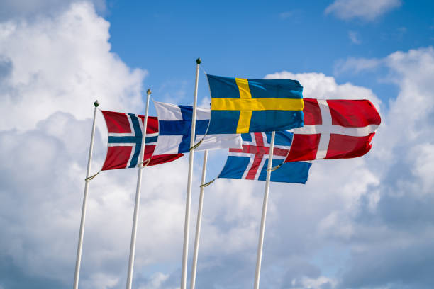 istock Scandinavian flags waving against cloudy sky 1399422104