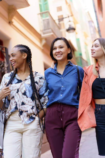 istock Cheerful diverse ladies spending time in city 1399422262