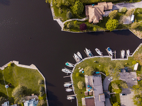Areal view of the Muskoka Canals off the Lake in Canada. Exterior drone view during the day.