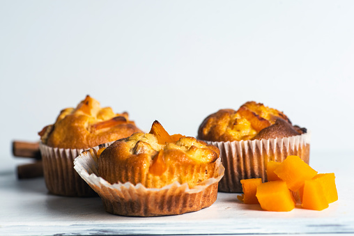 Homemade muffins with pumpkin isolated on white