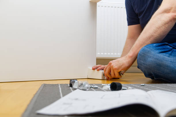 istock Professional Furniture Assembly Worker Assembles Shelf. Furniture assembly process. DIY Assembling 1399426244