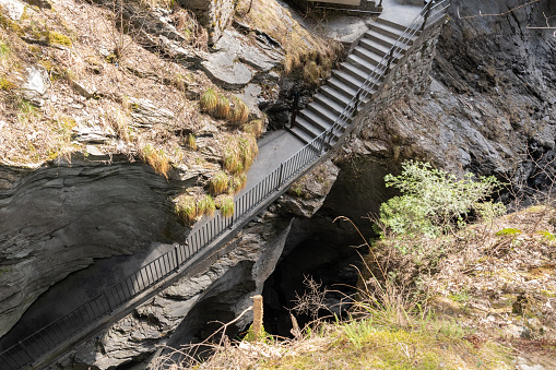 Zillis, Grison, Switzerland, April 12, 2022 Stairs are leading down to the Viamala canyon