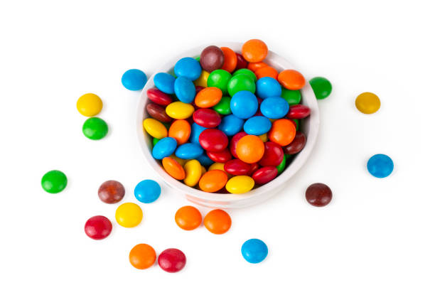 istock A Pile of Rainbow Colored Candy Coated Chocolate Buttons Isolated 1399429259