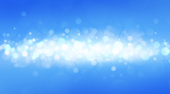 Bokeh on a blue background with space for text