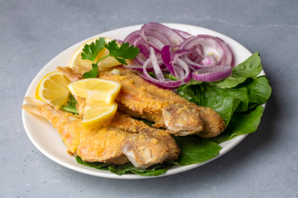 istock Plate of fried small fish red mullet and lemon 1399430706
