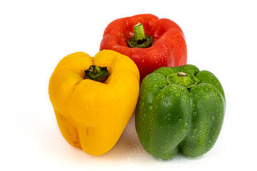 Fresh Red / Green / Yellow Capsicum isolated in extendable plain background with ample copy space and macro detailing