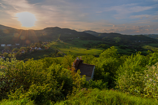 Sunset near old red buildings in Banska Stiavnica town in spring fresh evening