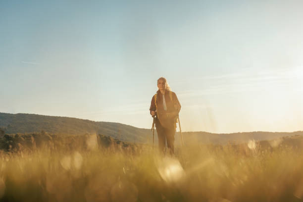 istock Woman hiking in sunset on a mountaing 1399438879