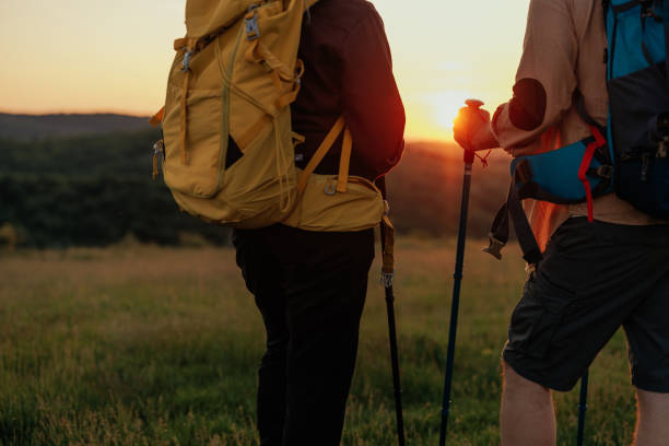 istock Couple walking on grassy landscape 1399438914